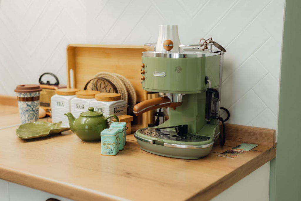 Home coffee bar ideas shown through a cozy espresso station with mugs and coffee containers.