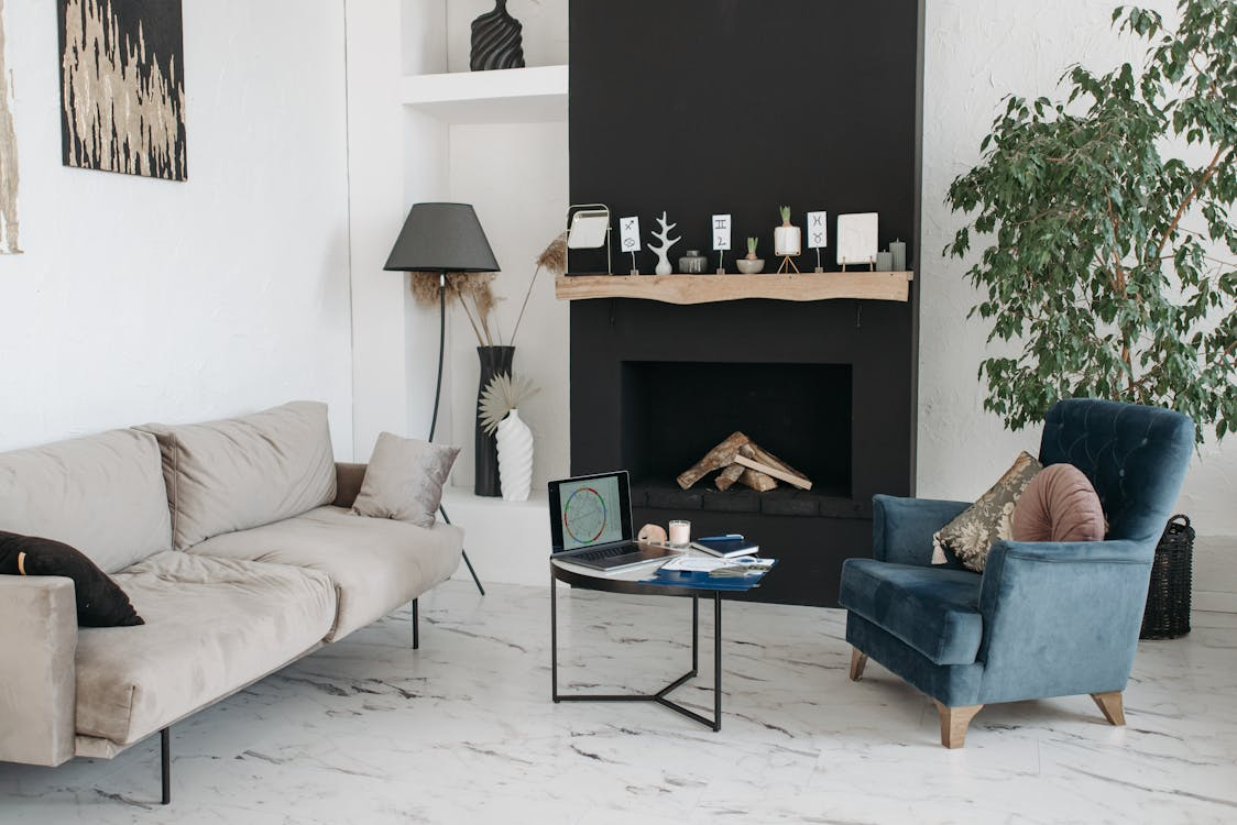 Why minimalism is changing shown through a warm minimalist living room with simple furniture.